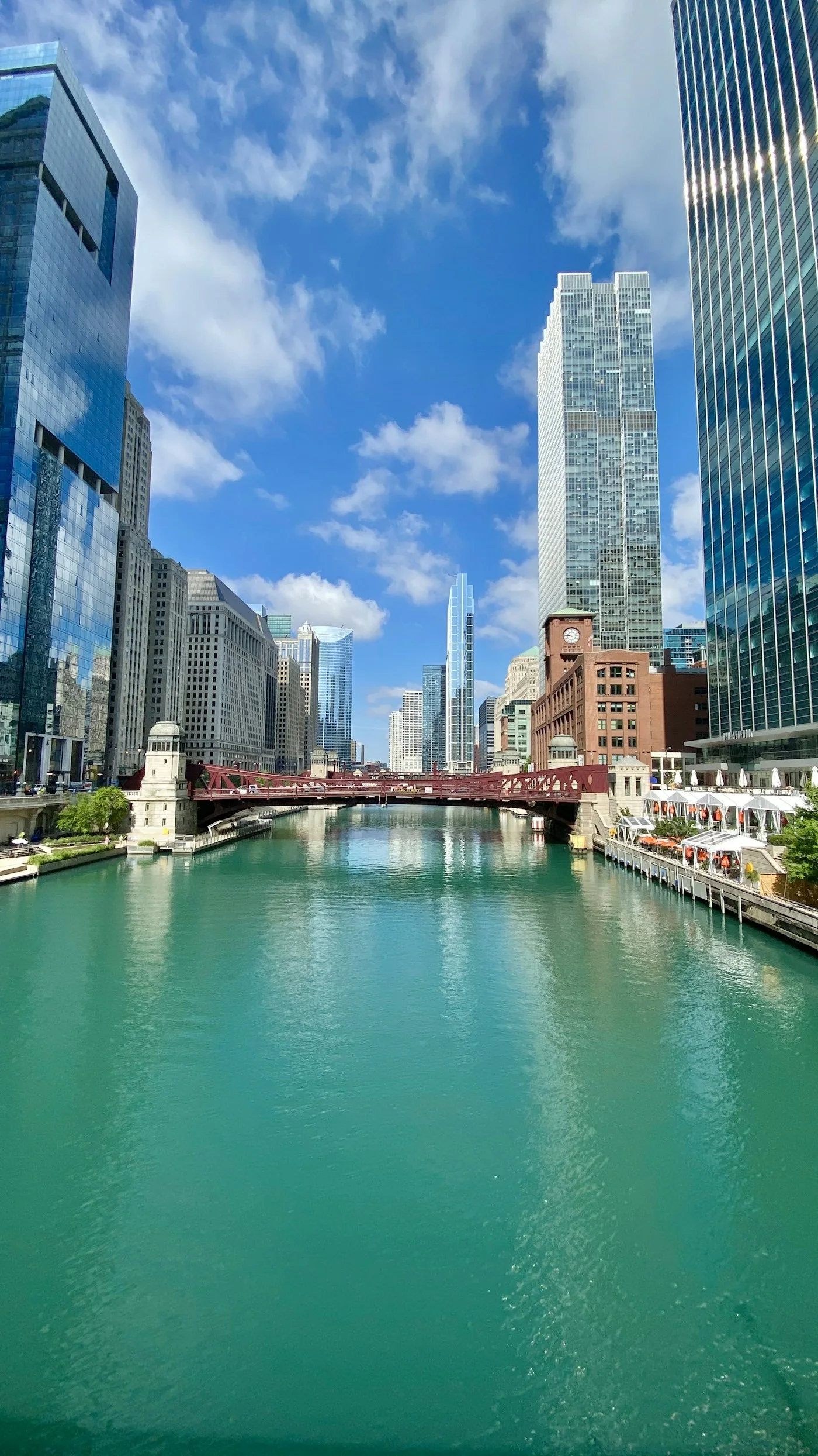 The Chicago River and downtown bridges beneath a bright sky