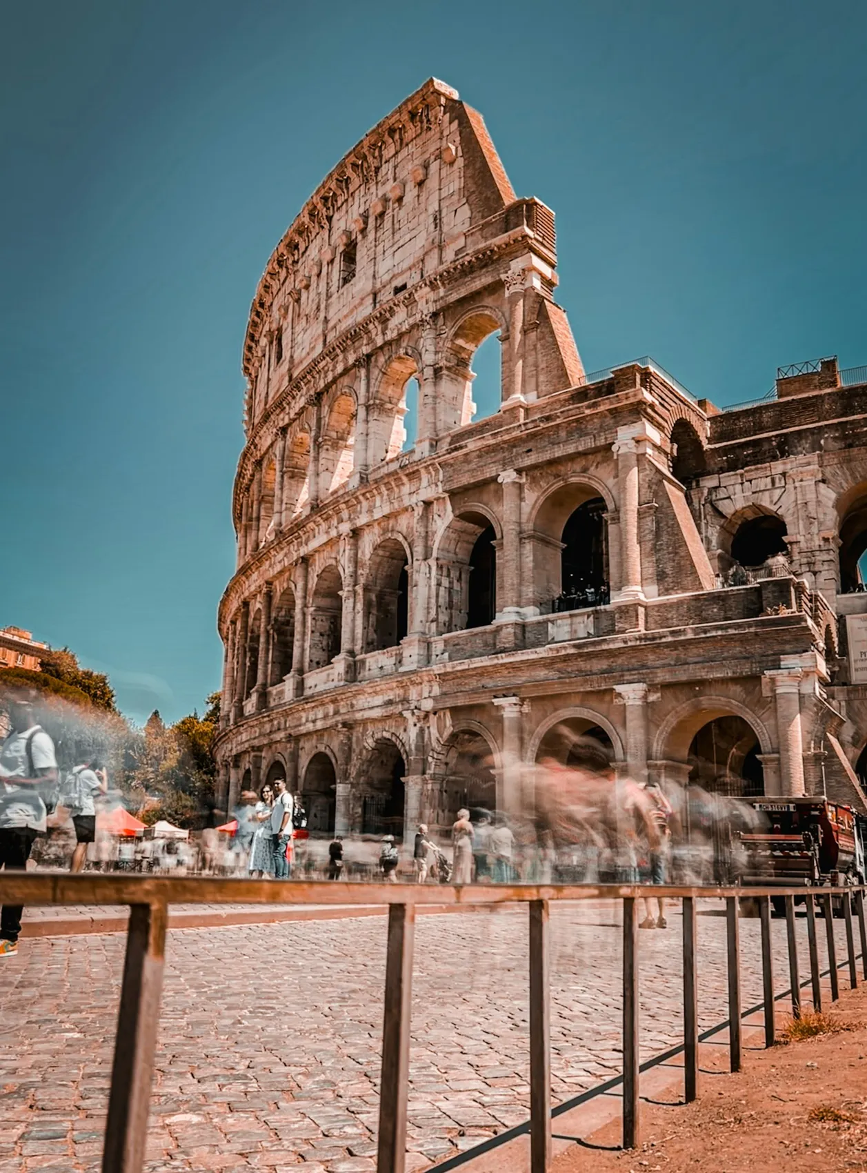 People passing the Colosseum arches