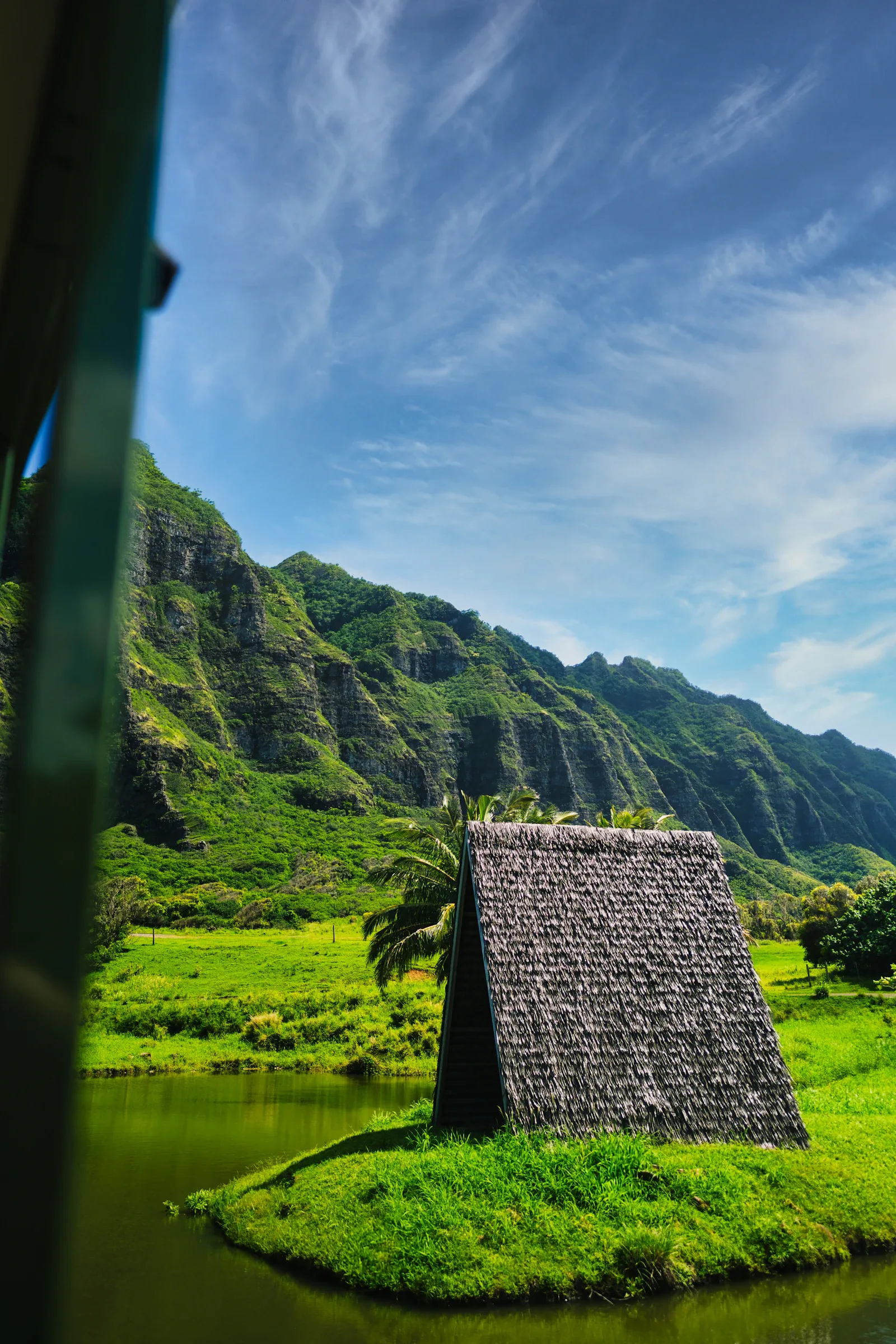 A small hut below the green mountains at Kualoa