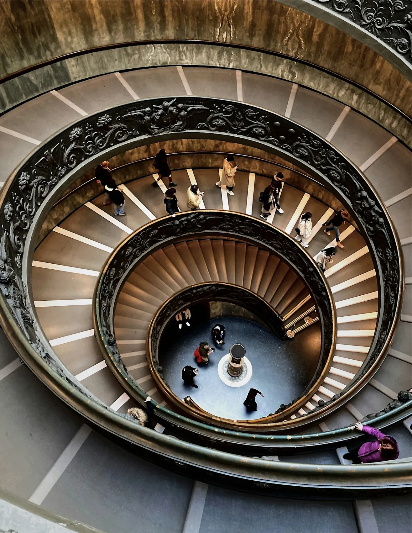 Visitors descending the museum staircase